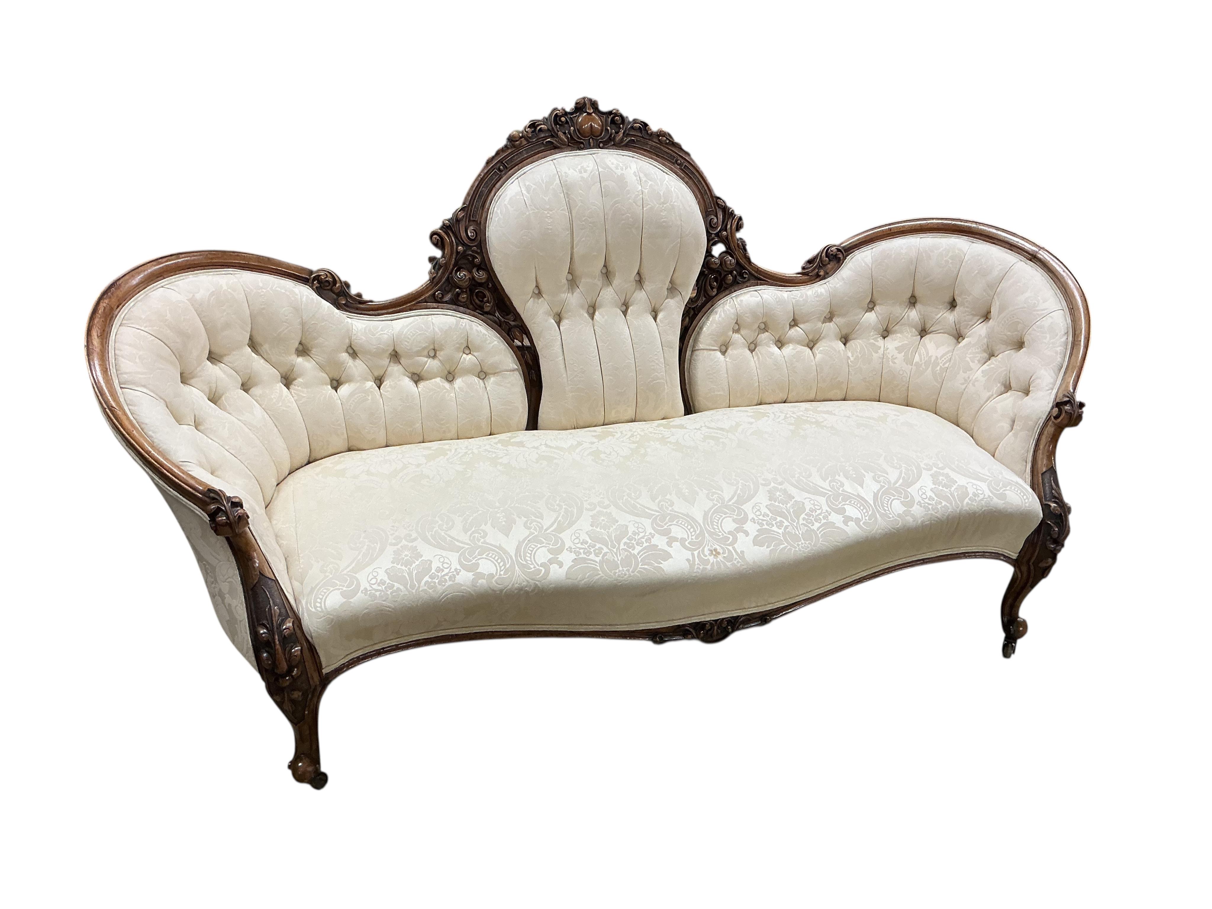 A Victorian carved mahogany walnut double spoon back settee, width 198cm, depth 79cm, height 101cm